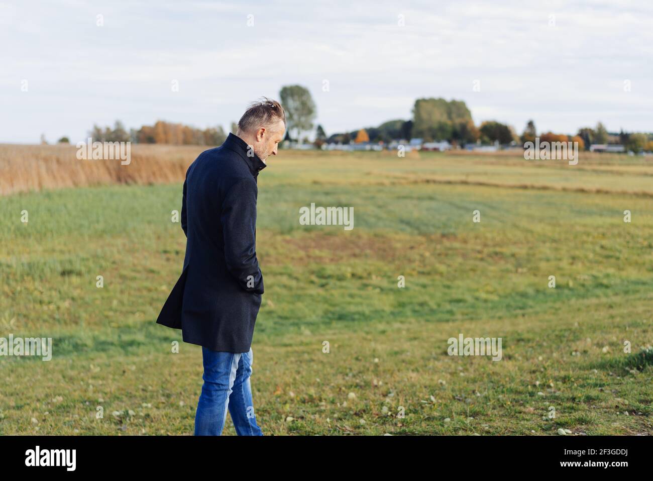 Middle aged man walking alone hi-res stock photography and images - Alamy