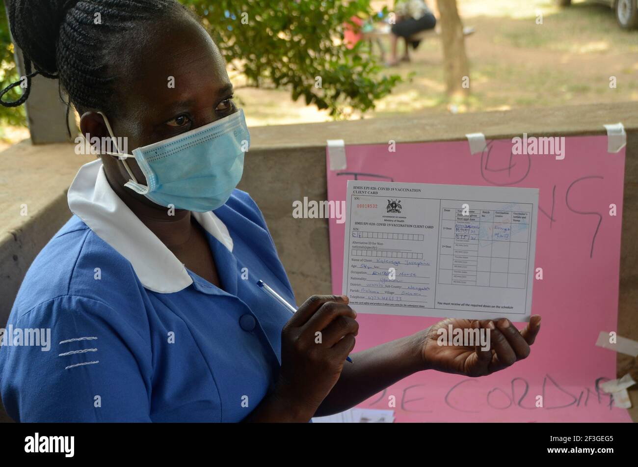 Wakiso, Uganda. 16th Mar, 2021. A medical worker shows COVID-19 vaccination card at Kasangati Health Center, Wakiso District, Central Region, Uganda, March 16, 2021. Uganda on March 10 rolled out a coronavirus vaccination exercise in phases after the country receives the first shipment of the AstraZeneca vaccines on March 5. Credit: Nicholas Kajoba/Xinhua/Alamy Live News Stock Photo