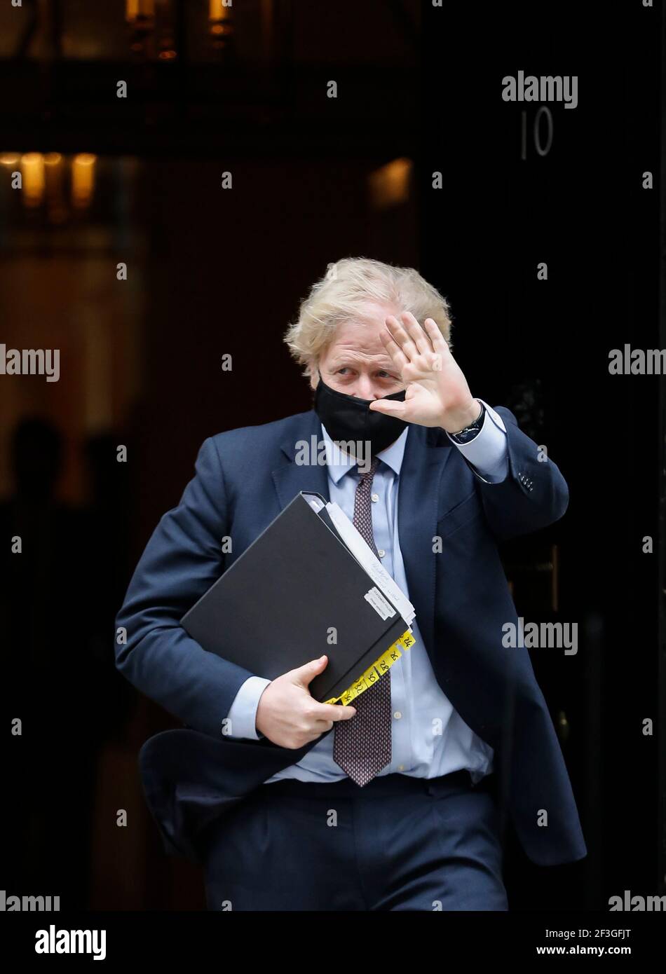 (210317) -- LONDON, March 17, 2021 (Xinhua) -- British Prime Minister Boris Johnson leaves 10 Downing Street for the House of Commons to make a statement on the Integrated Review of Security, Defence, Development and Foreign Policy in London, Britain, on March 16, 2021. Britain is set to reverse its previous policy to reduce its stockpile of nuclear weapons and instead plans to increase the number of nuclear warheads to 260, the British government announced Tuesday. The latest development came as Britain on Tuesday published the 114-page Integrated Review of Security, Defense, Development a Stock Photo
