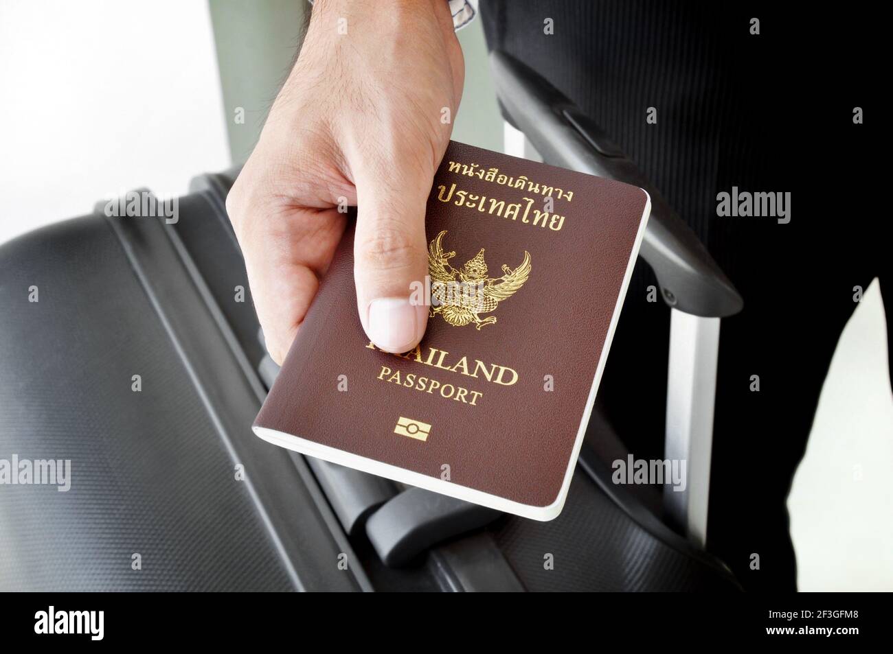 A man giving passport Stock Photo Alamy
