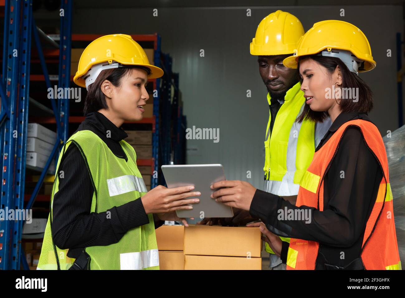 Warehouse worker working together in the storehouse . Logistics