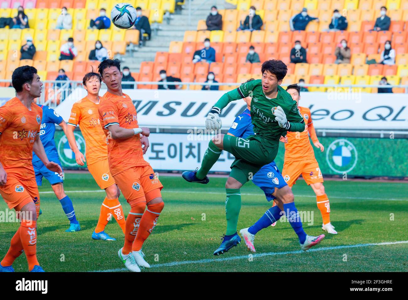 Seoul, South Korea. 14th Mar, 2021. Lee Bum-Soo (front R, Gangwon FC), Mar 14, 2021 - Football/Soccer : Gangwon FC goalkeeper Lee Bum-Soo punches the ball during the 4th round of the 2021 K League 1 soccer match between Suwon Samsung Bluewings FC 1:1 Gangwon FC at the Suwon World Cup Stadium in Suwon, south of Seoul, South Korea. Credit: Lee Jae-Won/AFLO/Alamy Live News Stock Photo