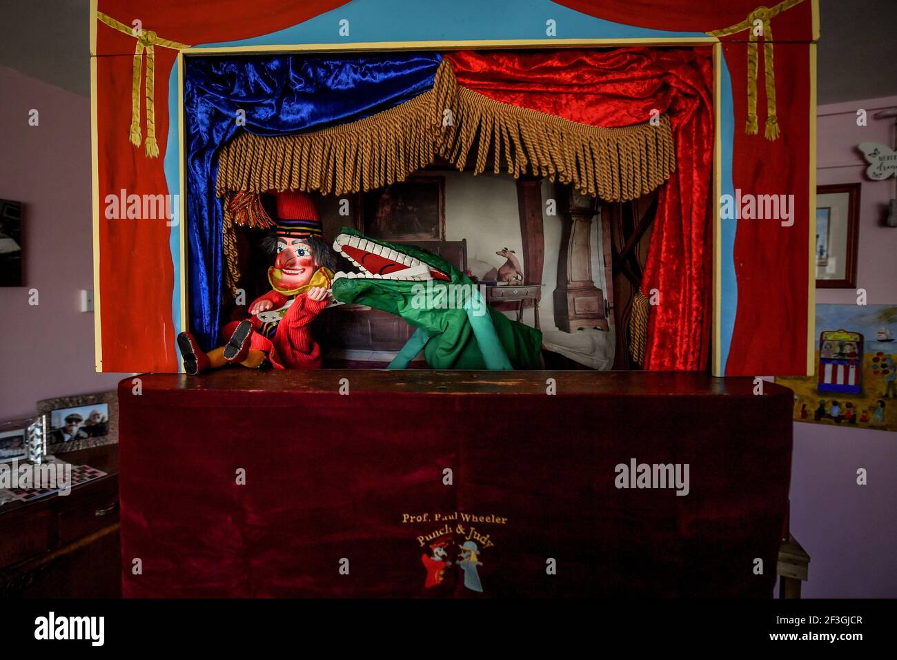 Punch & Judy puppets Punch and the crocodile play tugofwar with a