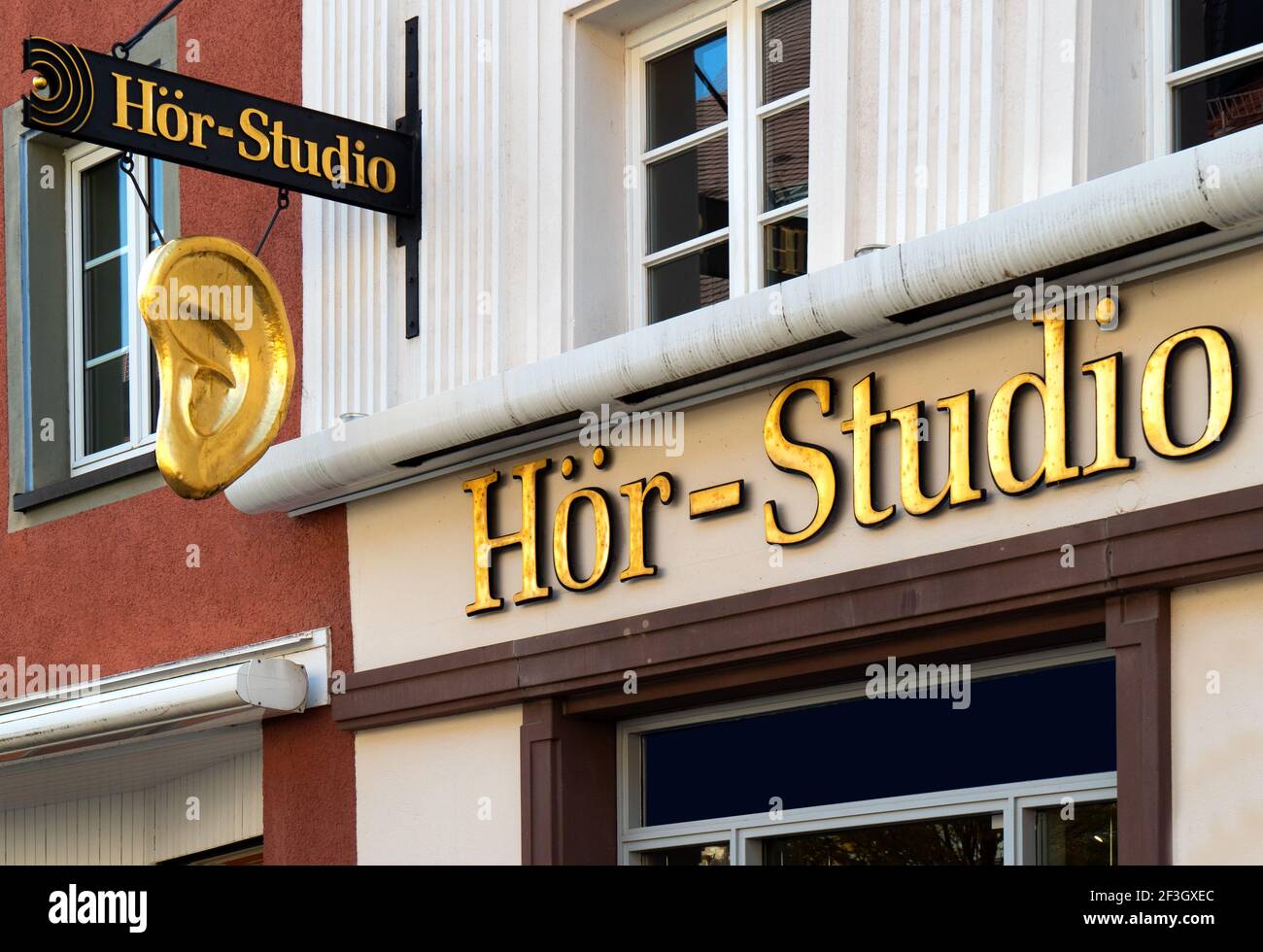 Hör Studio - hearing studio lettering and symbol of a ear on a facade in Stuttgart, Germany Stock Photo