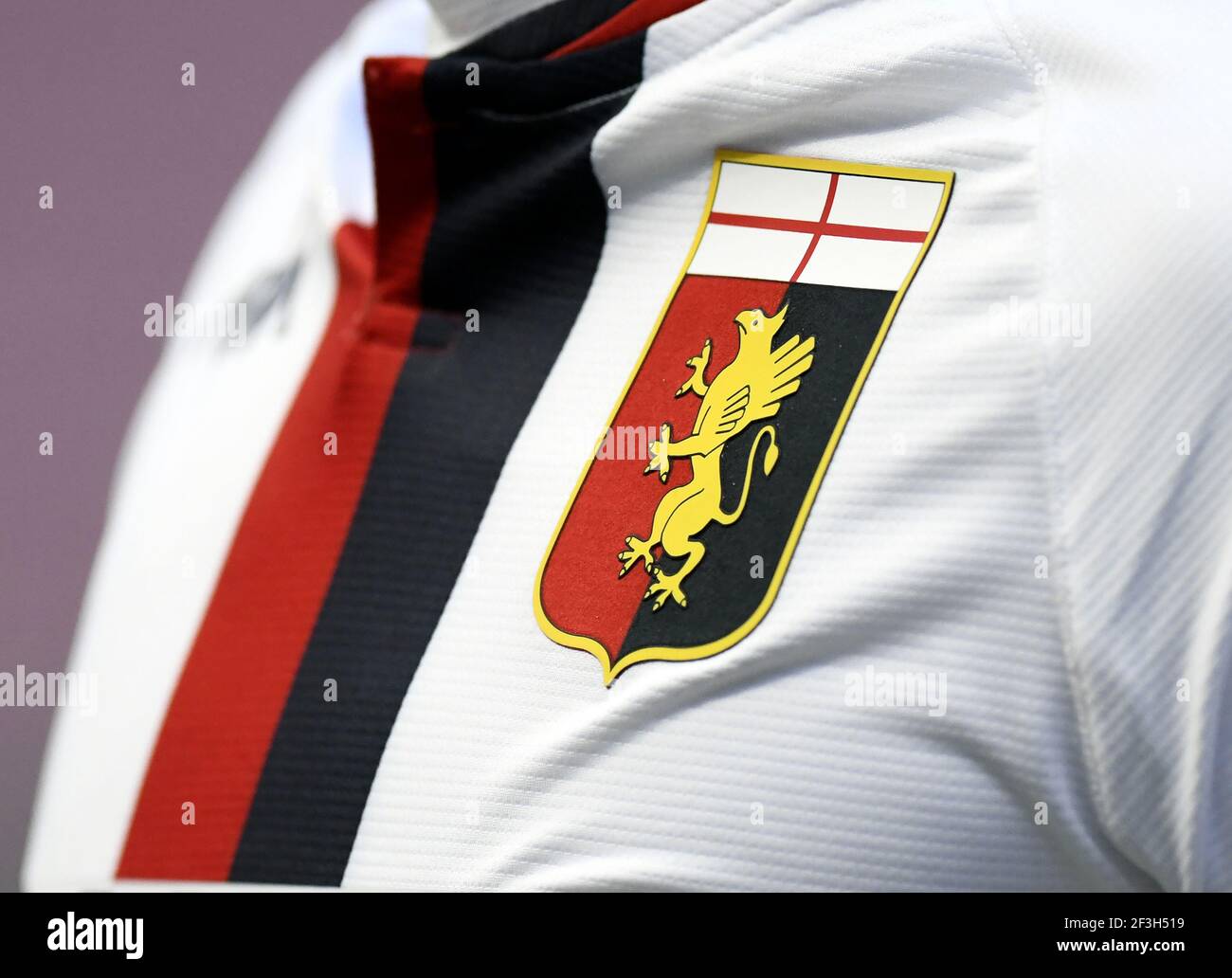 Genoa Cricket and Football Club's logo an symbol on the official team's uniform. Genoa is the oldest Italian football team founded on 1893. Stock Photo