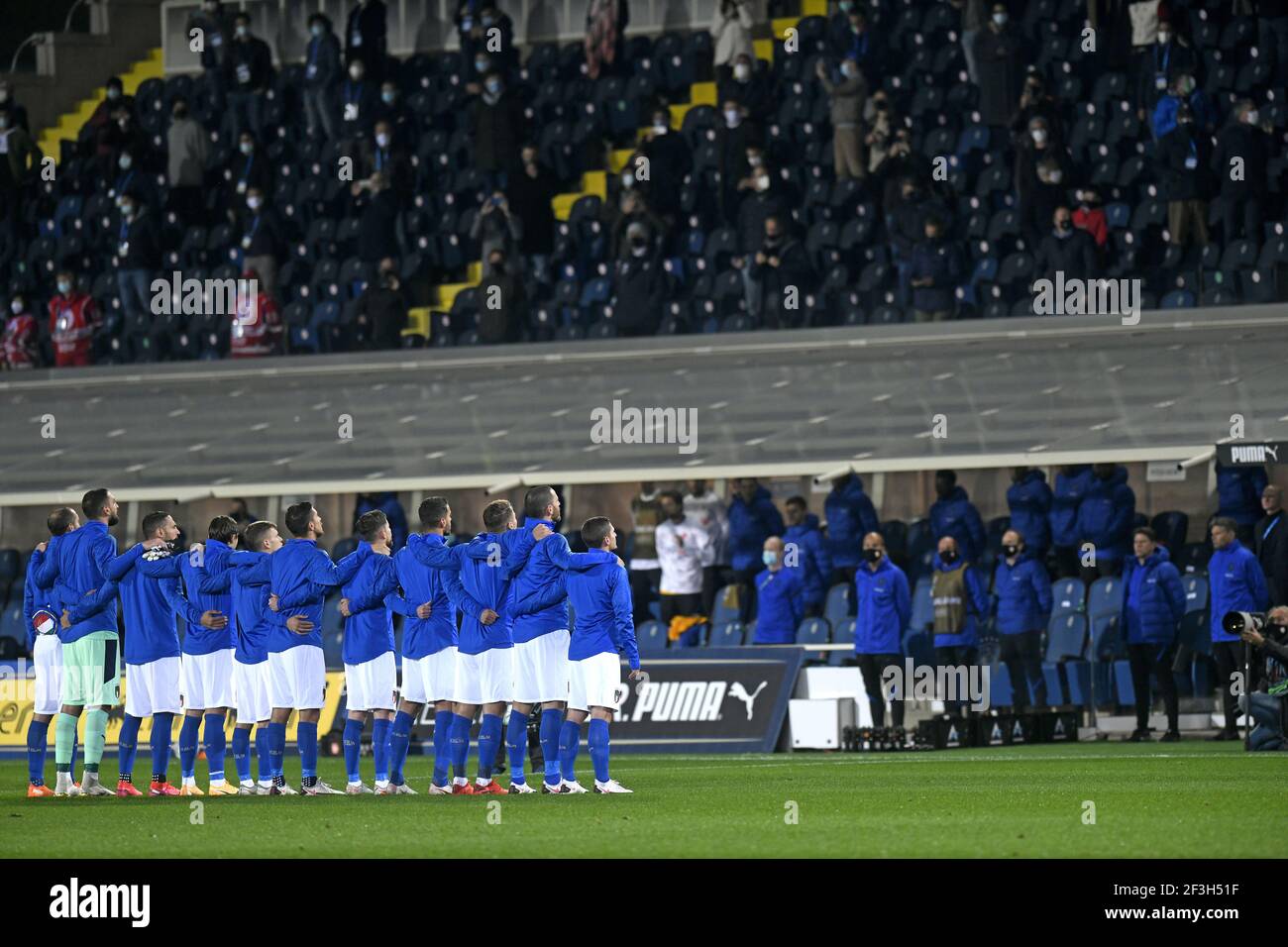 Italian football team players embrace each other during the national anthem, before the Nations League's match Italy vs Netherlands, in Bergamo. Stock Photo