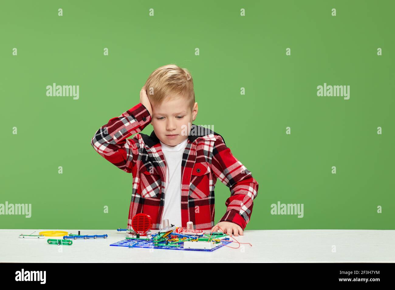 children playing with electronic constructor at studio Stock Photo