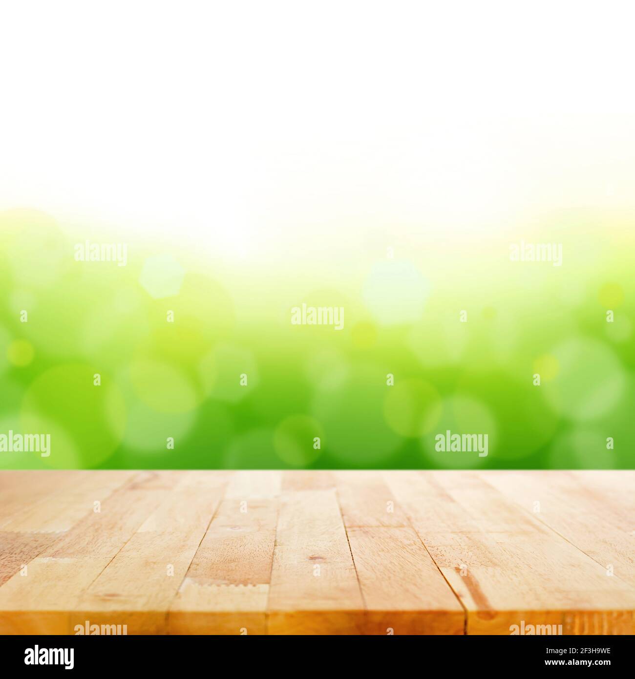 Wood table top on white green bokeh abstract background Stock Photo - Alamy