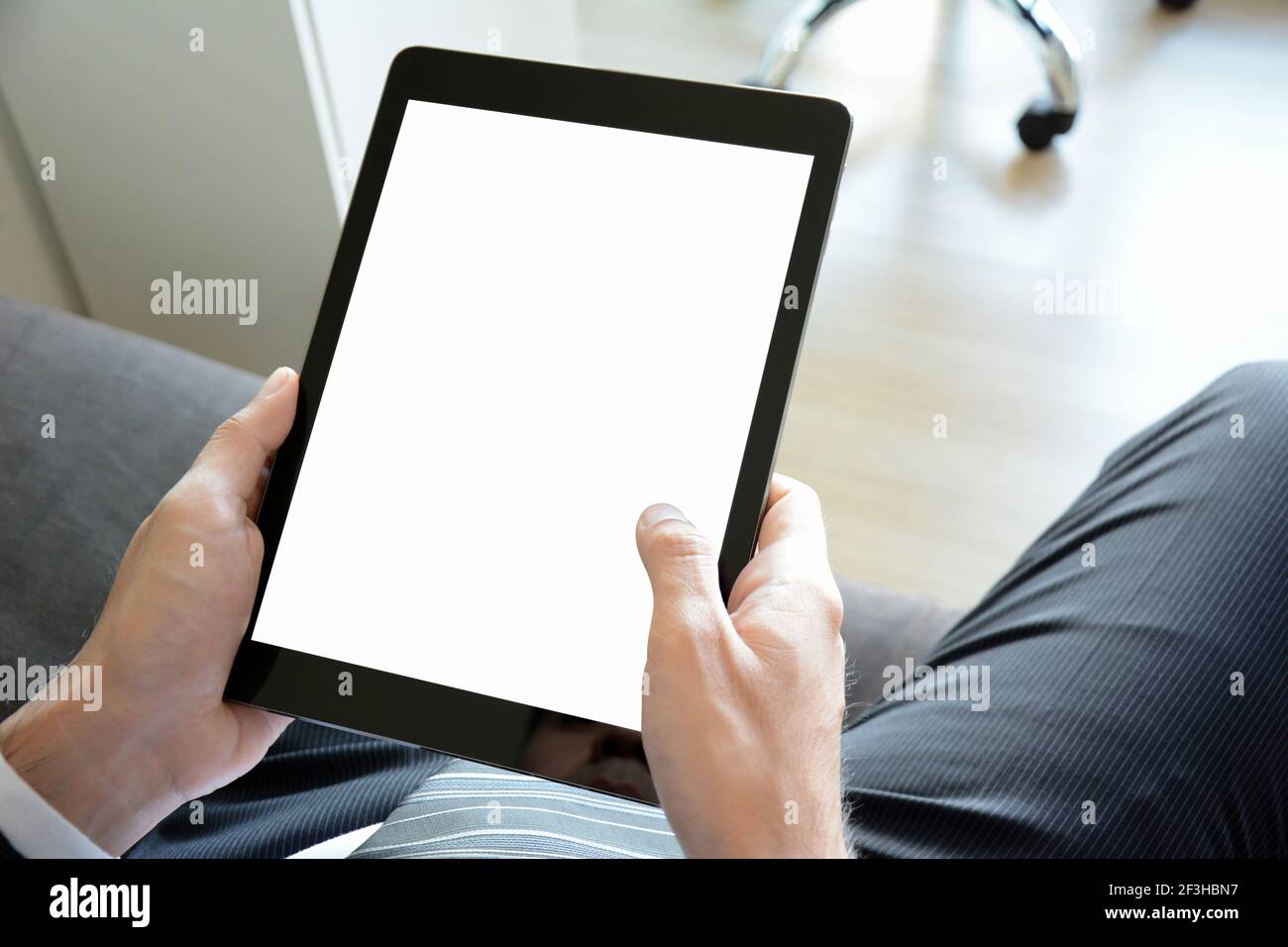 Hands holding tablet pc with empty screen Stock Photo