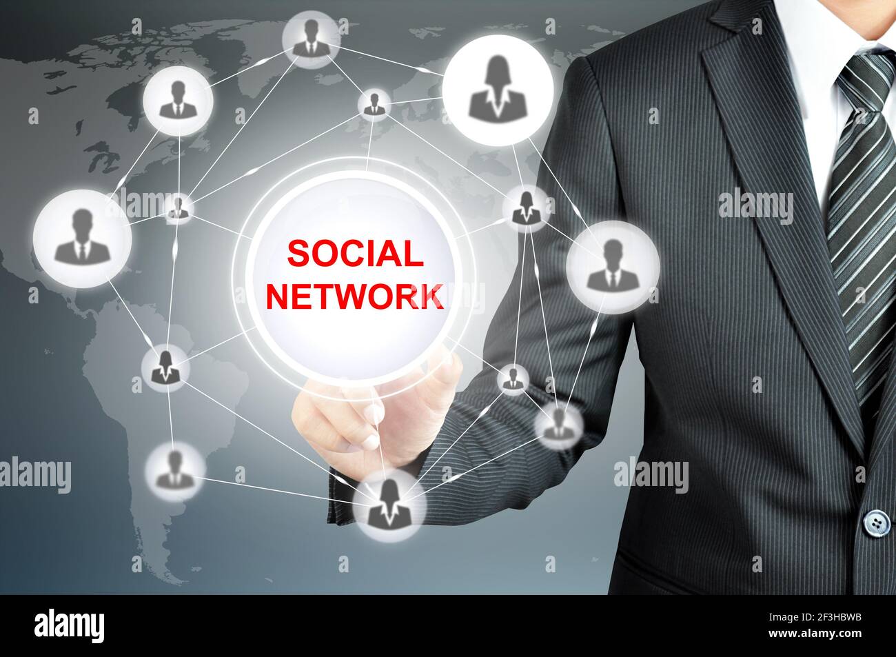 Businessman hand touching SOCIAL NETWORK sign on virtual screen Stock Photo
