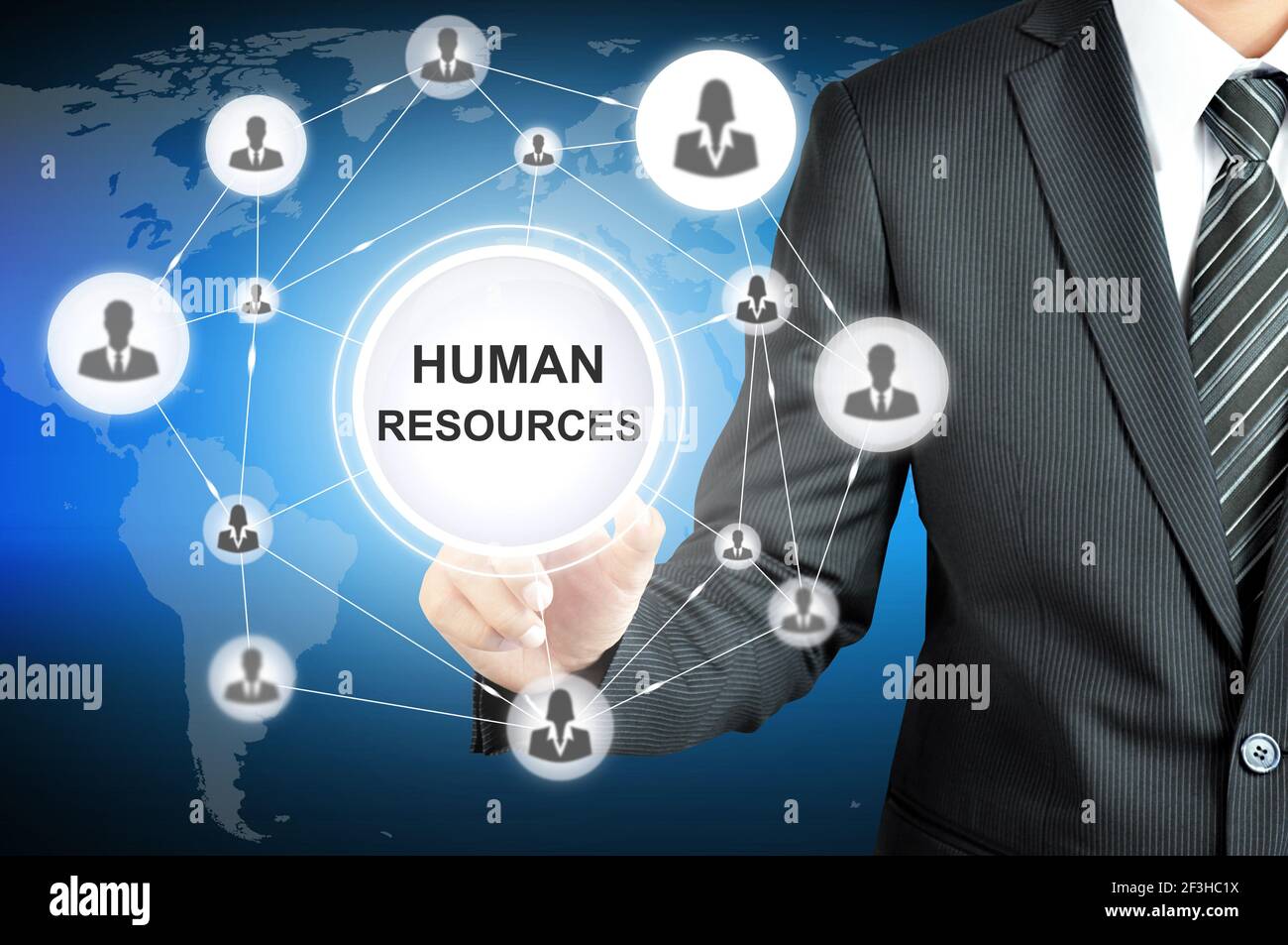 Businessman hand pointing on HUMAN RESOURCES sign on virtual screen with human icons linked as network Stock Photo