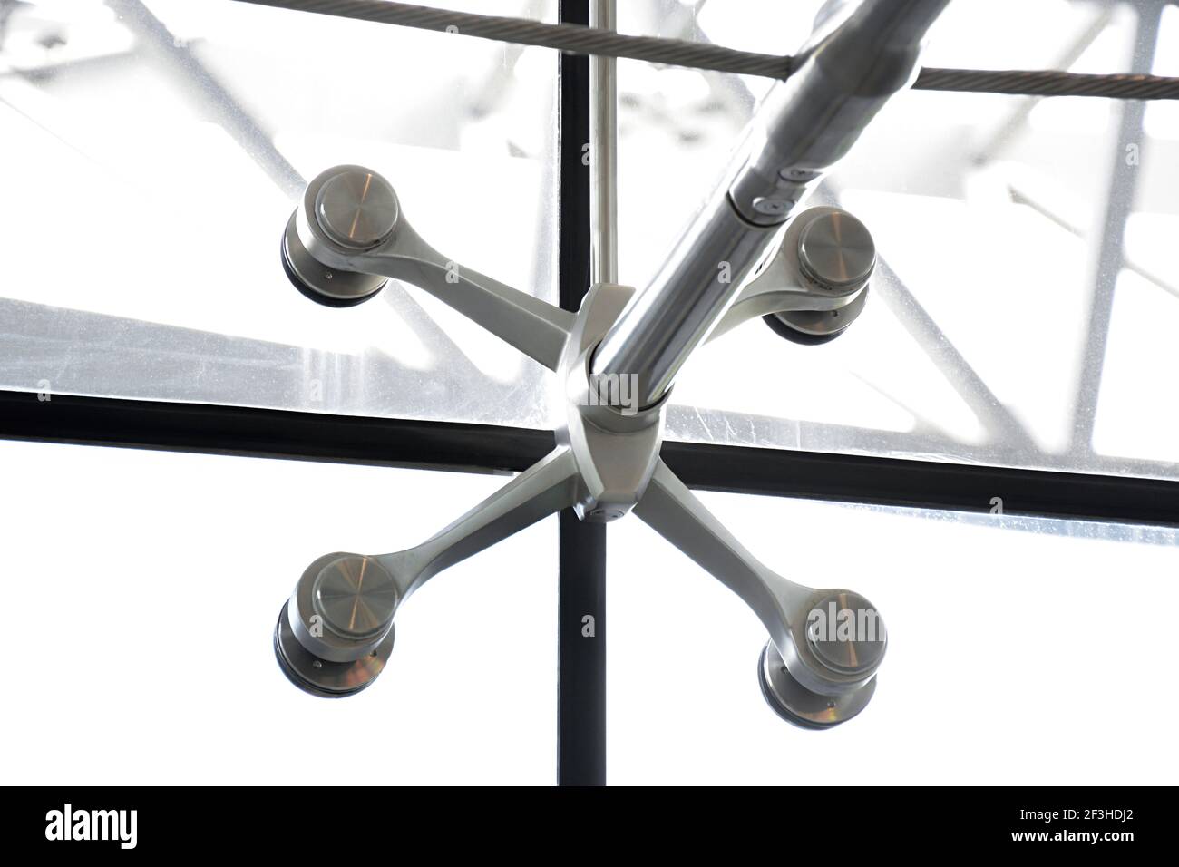 Glass wall with spider mounting clamp, mostly used in modern style