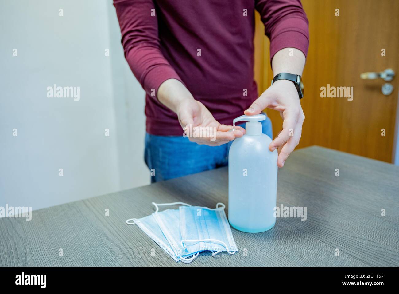 Man cleaning laptop and tablet with white wipe Stock Photo