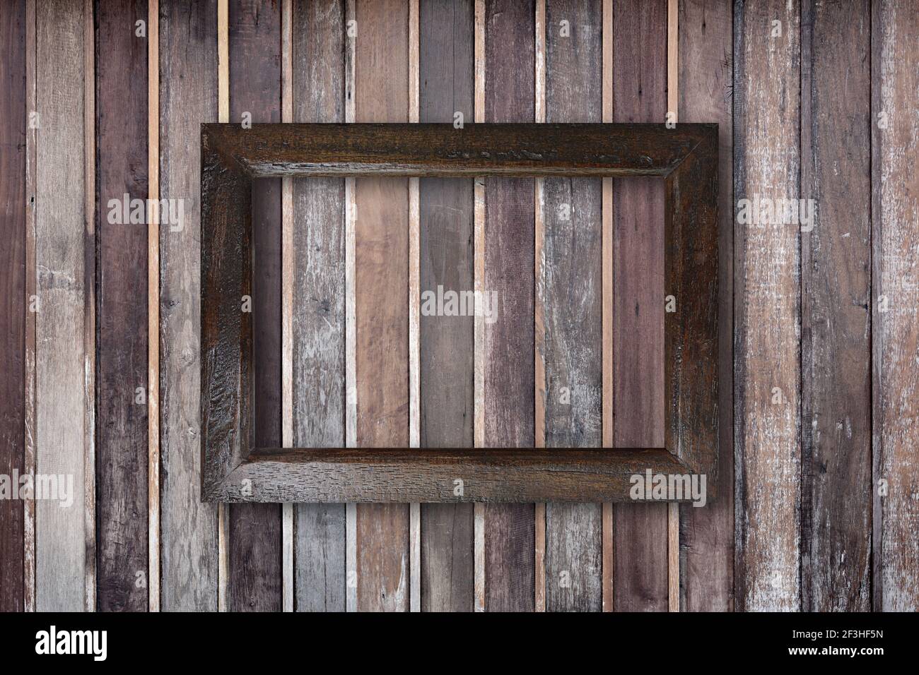 Picture frame on old wooden wall Stock Photo - Alamy