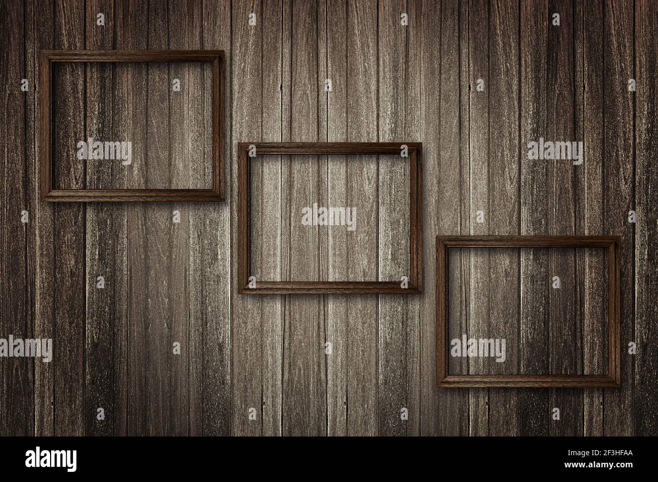 Picture frames on dark wooden wall Stock Photo Alamy