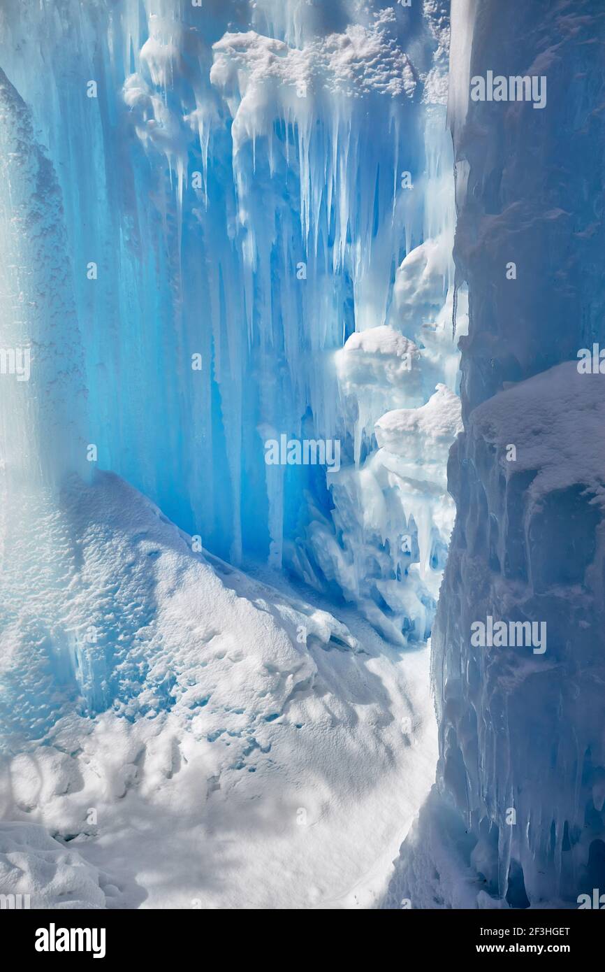 Frozen mountain waterfall with icicles texture close up Stock Photo