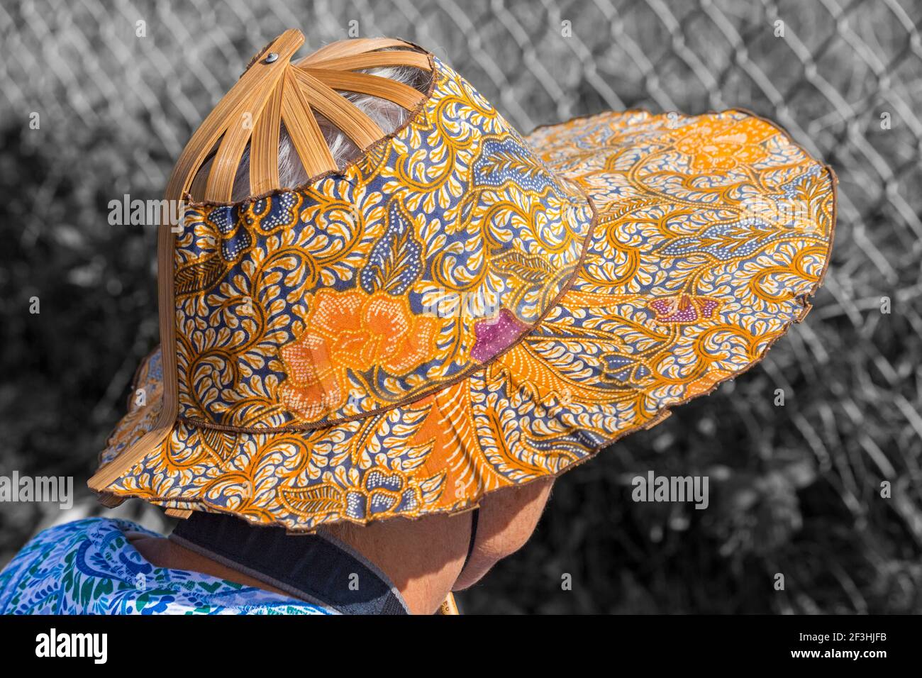 Woman wearing oriental style sunhat at Bournemouth Air Festival, Dorset UK in August Stock Photo