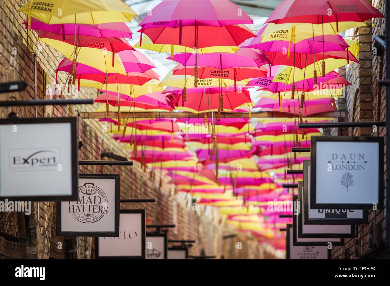 London, UK - 26 February, 2021 - The colourful umbrella alley in Camden stables market Stock Photo