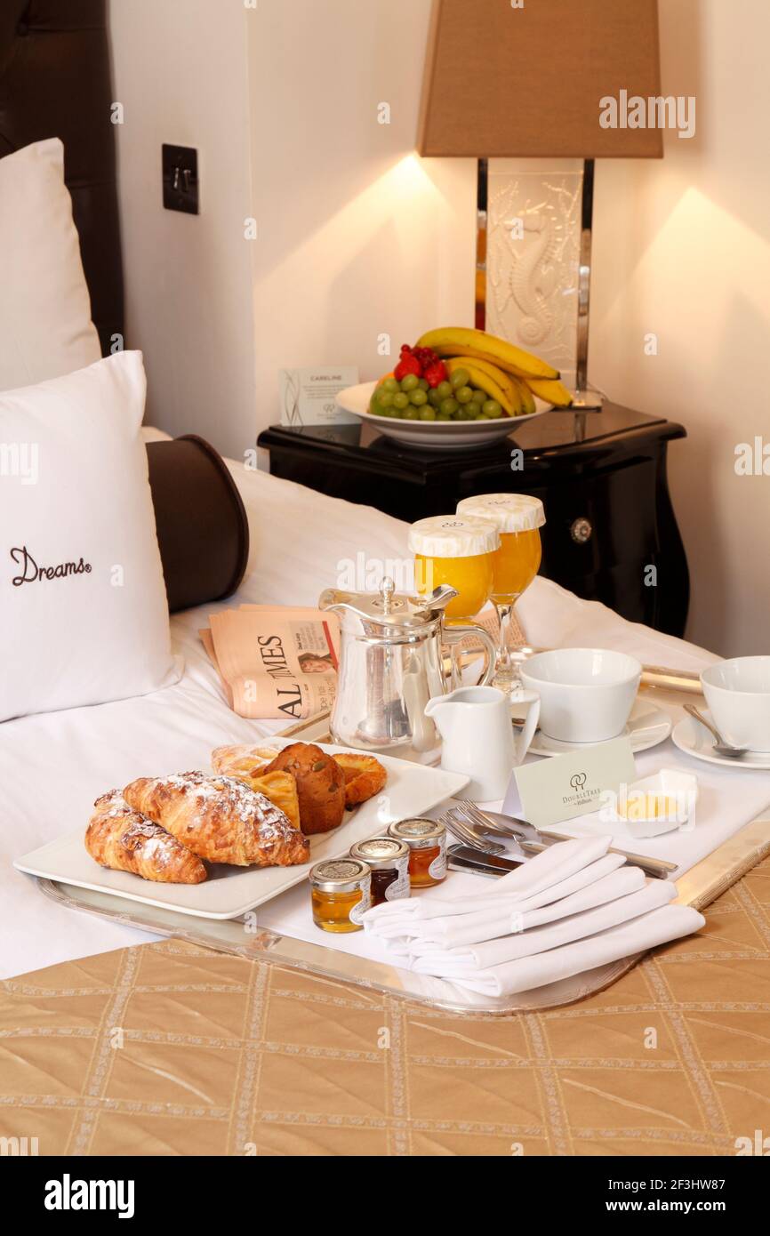 Breakfast tray with newspaper on bed NONE Stock Photo Alamy