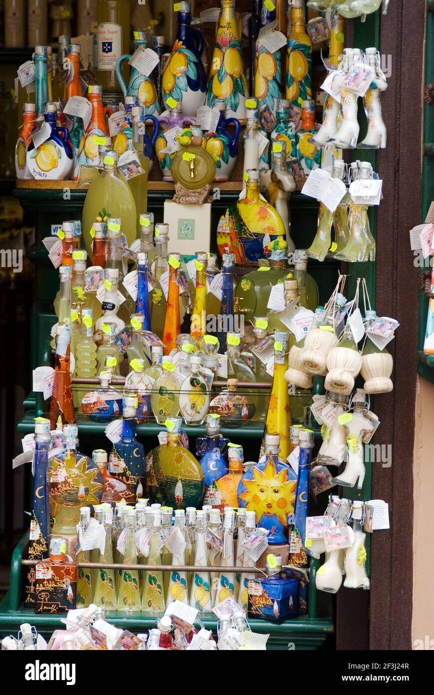 Limoncello (the local lemon liquer) bottles and souvenirs for sale outside of a shop, Amalfi, Amalfi Coast, Campania, Italy | NONE | Stock Photo