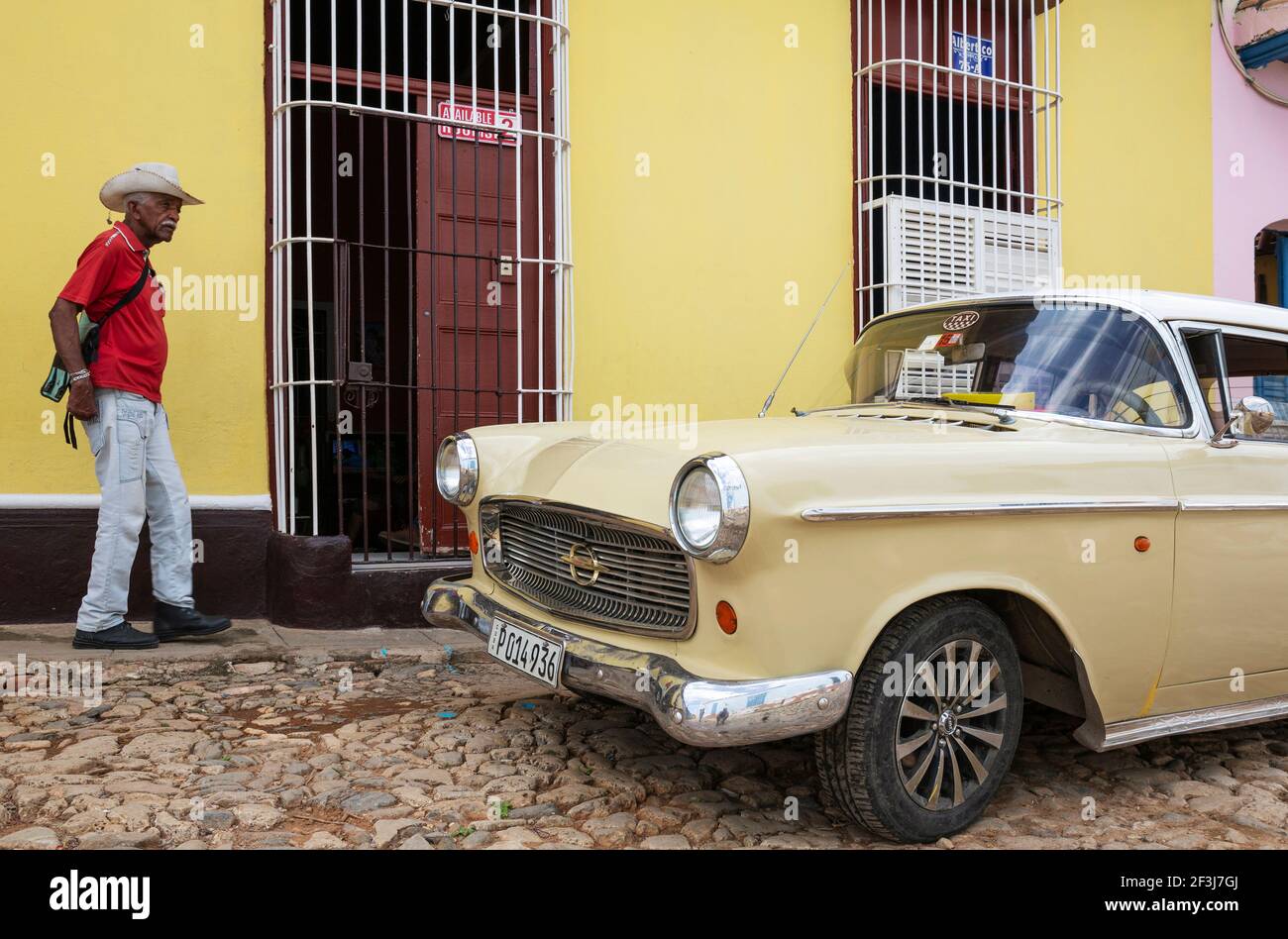 Classic car Opel KapitÃ¤n and passer-by, Trinidad, Cuba Stock Photo
