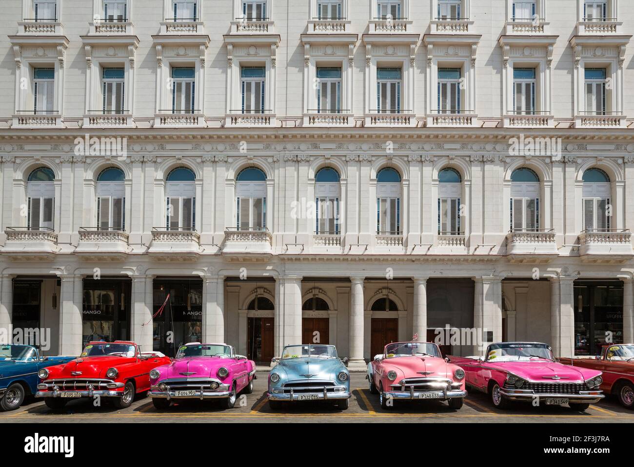 US classic cars from the 1950s can be hired for touristic city tours, Havana, Cuba Stock Photo