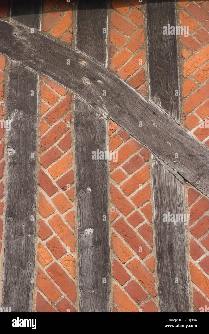 Diagonally oriented bricks and half-timbered frame of the Elizabethan Moot House Town Hall, Aldeburgh, Suffolk, England | NONE | Stock Photo