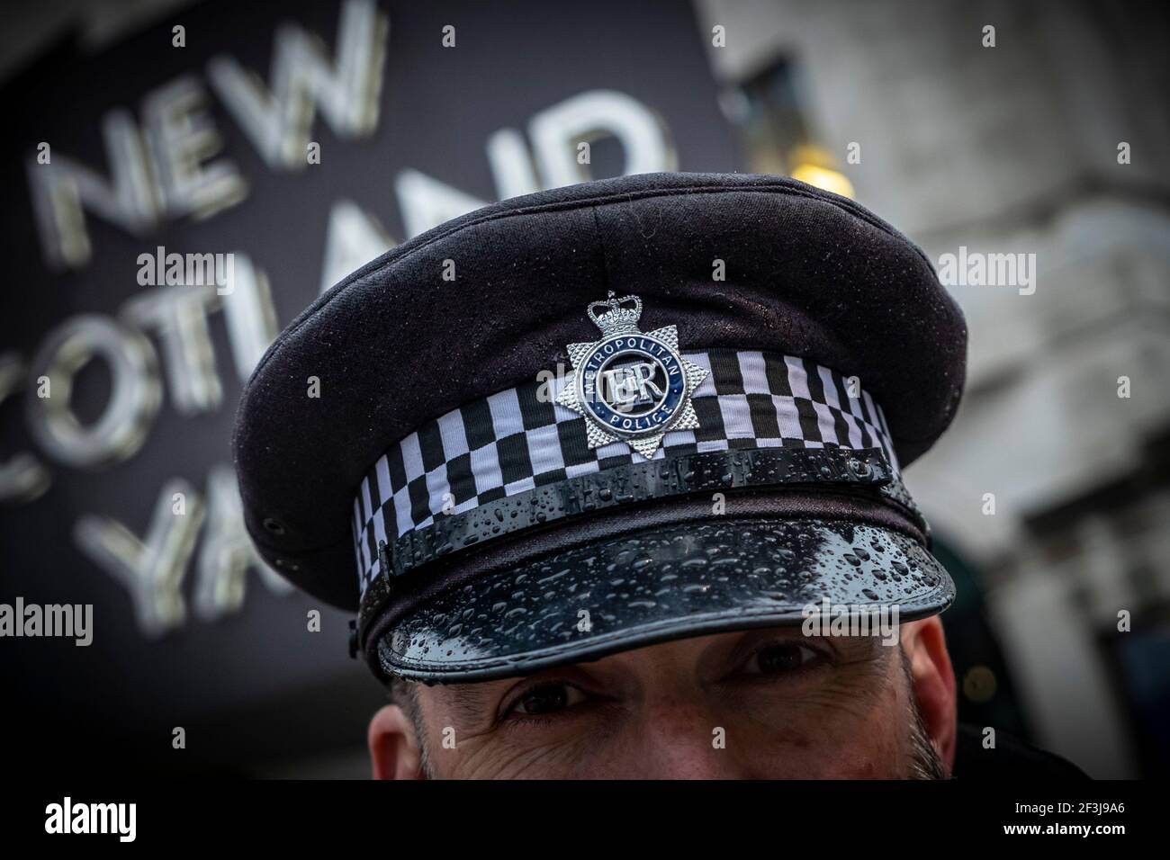 Metropolitan Police Officer wearing a cap at scotland yard Photography by Jason Bye t:  07966 173 930 e: mail@jasonbye.com w: http://www.jasonbye.com Stock Photo