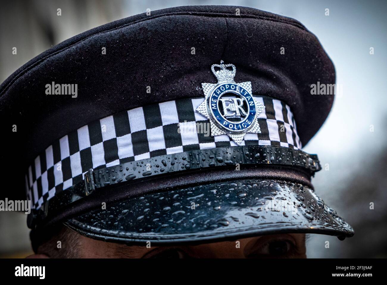 Metropolitan Police Officer wearing a cap at scotland yard Photography by Jason Bye t:  07966 173 930 e: mail@jasonbye.com w: http://www.jasonbye.com Stock Photo