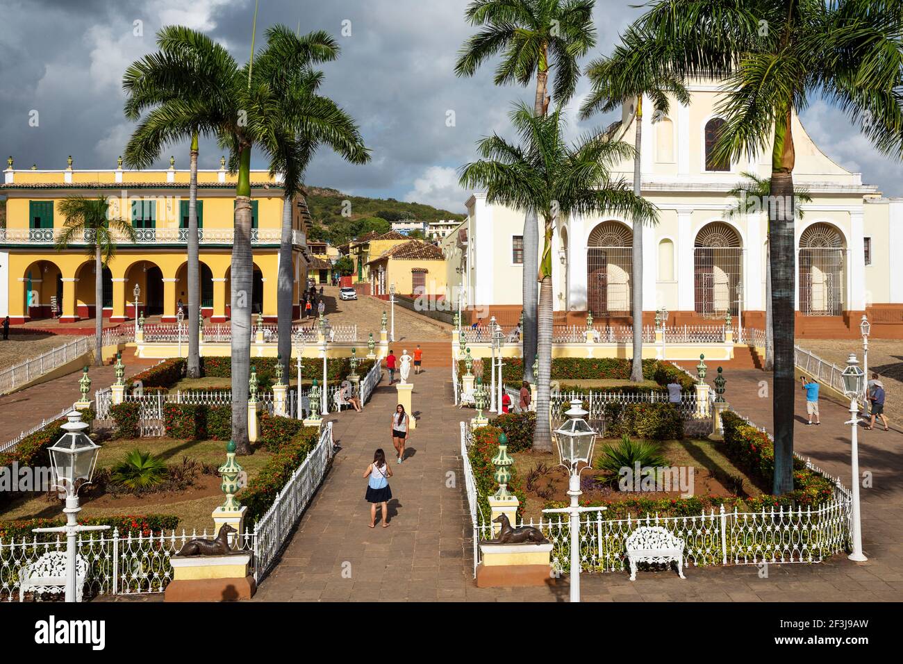 Plaza Mayor with the Museo RomÃ¡ntico on the left and the Iglesia de la SantÃsima Trinidad on the right, Trinidad, Cuba Stock Photo