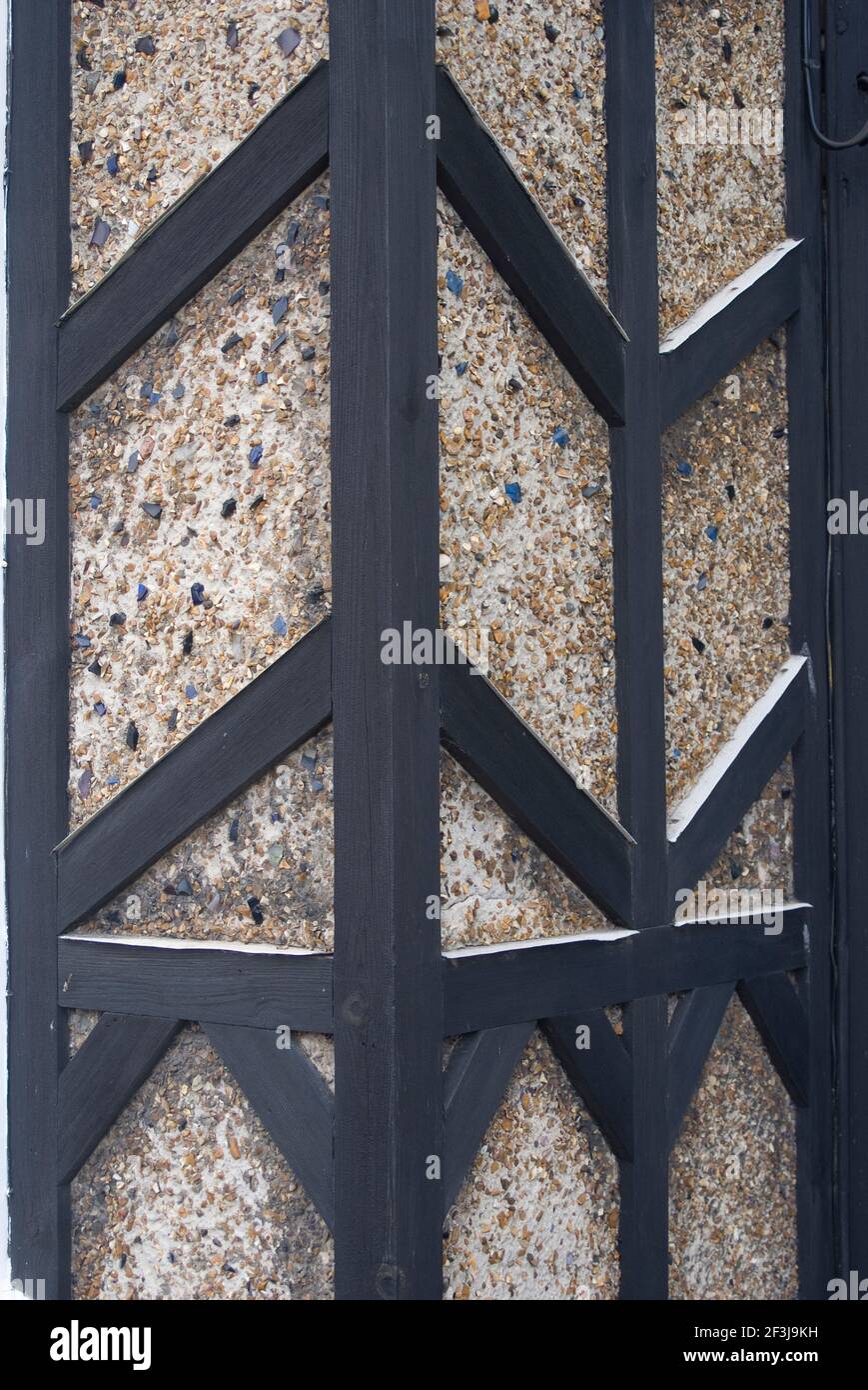 Black painted wood frame and pebble dash detail on a house, Aldeburgh, Suffolk, England | NONE | Stock Photo