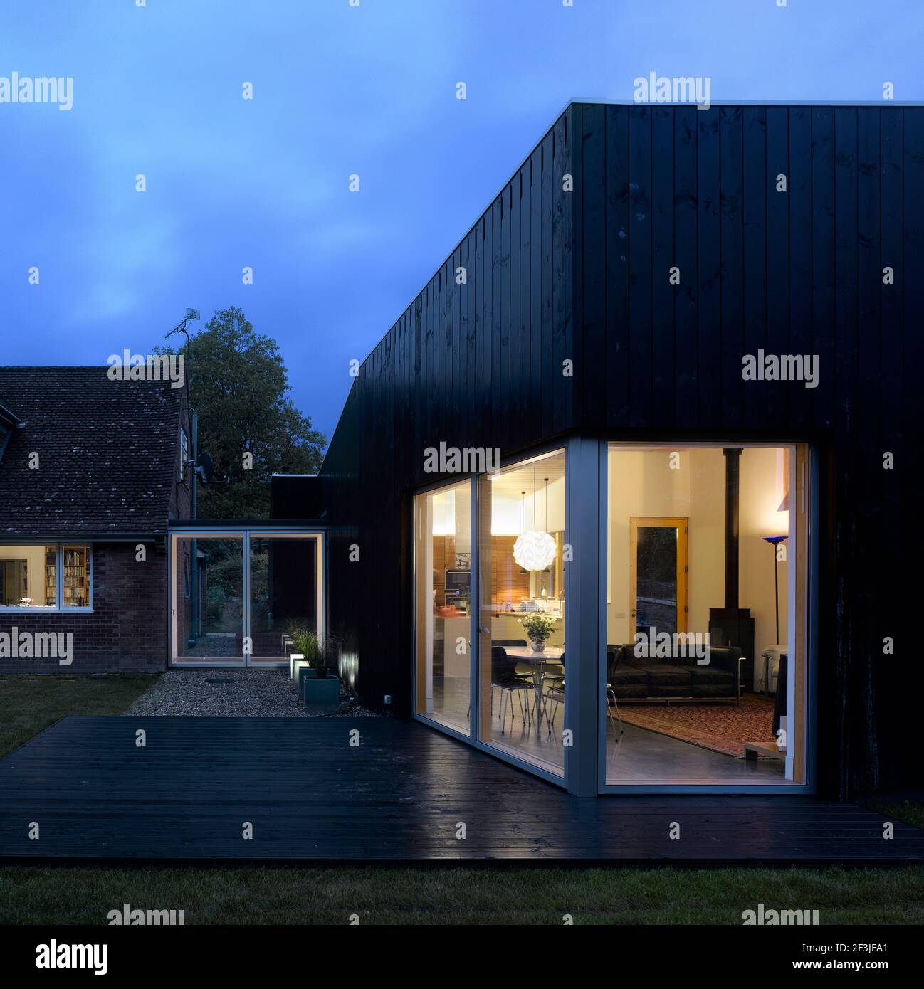 Dusk shot of new wing of Farnham House Architect Paul Archer Design