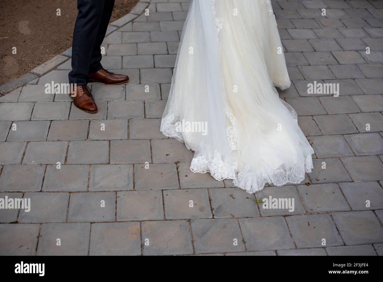 Bride and groom shot from midsection down Stock Photo