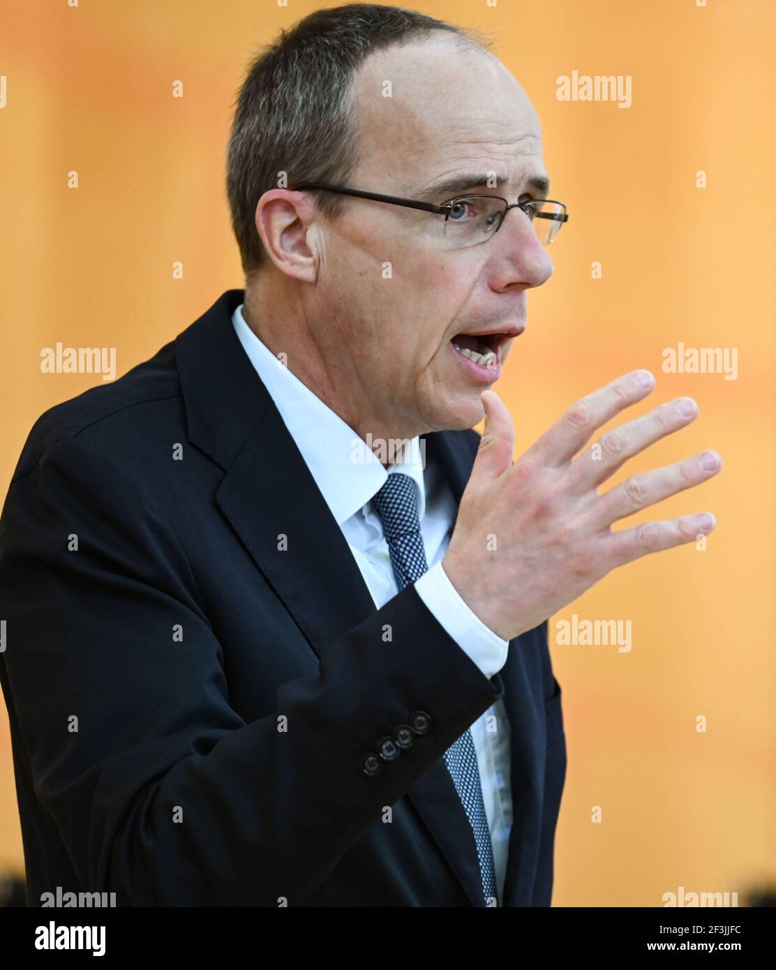 Wiesbaden, Germany. 17th Mar, 2021. Peter Beuth (CDU), Minister of the Interior of the State of Hesse, speaks in the Hessian parliament during the debate on the consequences of the racially motivated attack in Hanau. On the evening of February 19, 2020, 43-year-old German Tobias R. had shot nine people at several locations in the city in the Rhine-Main region for racist motives before presumably killing his mother and then himself. Credit: Arne Dedert/dpa/Alamy Live News Stock Photo