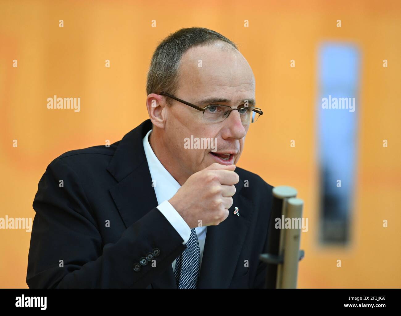 Wiesbaden, Germany. 17th Mar, 2021. Peter Beuth (CDU), Minister of the Interior of the State of Hesse, speaks in the Hessian parliament during the debate on the consequences of the racially motivated attack in Hanau. On the evening of February 19, 2020, 43-year-old German Tobias R. had shot nine people at several locations in the city in the Rhine-Main region for racist motives before presumably killing his mother and then himself. Credit: Arne Dedert/dpa/Alamy Live News Stock Photo