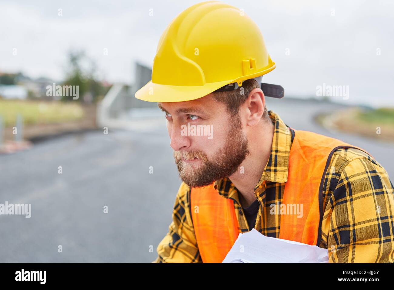 Workers as foremen when building a house during the planning on the construction site in the new development area Stock Photo
