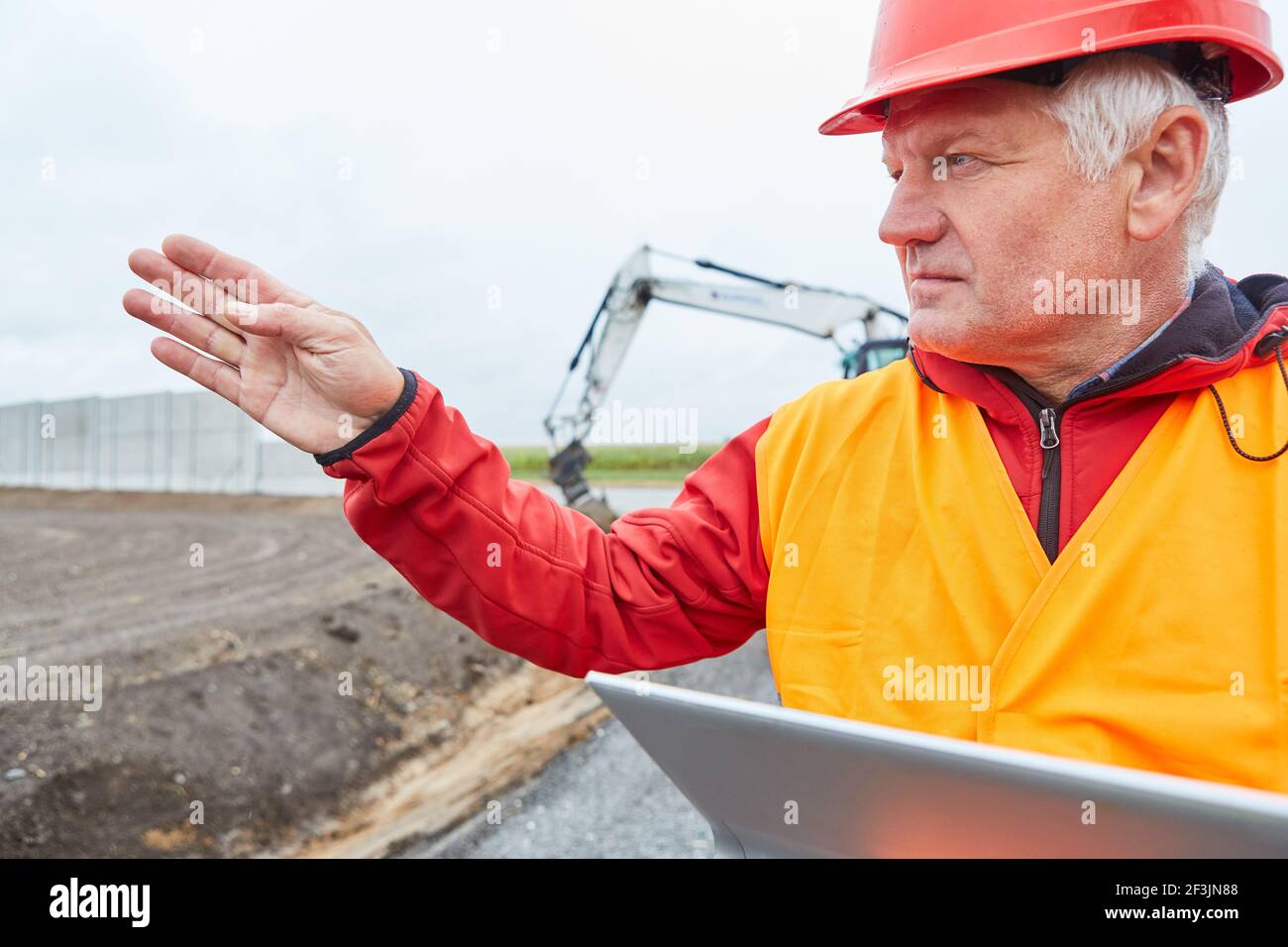 Architect or site manager with tablet computer when developing a new building area Stock Photo