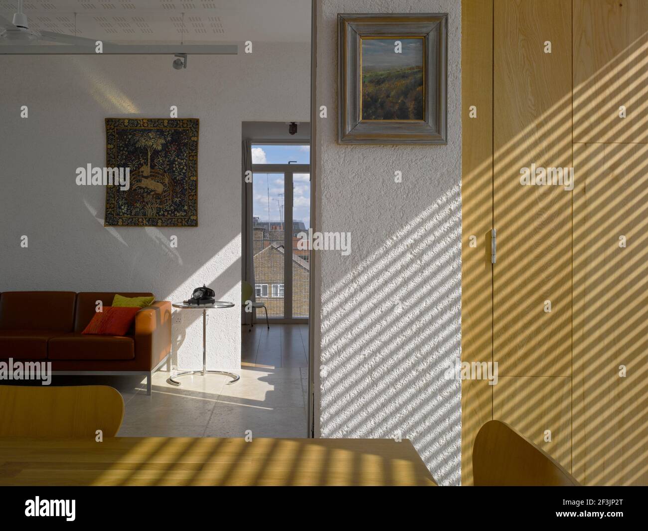 Sunlight filters into modern sitting room, Southwark Penthouse, London Stock Photo