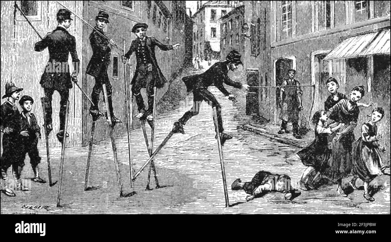 Collegians of brive la gaillarde return from a viper hunt on stilts. Stock Photo