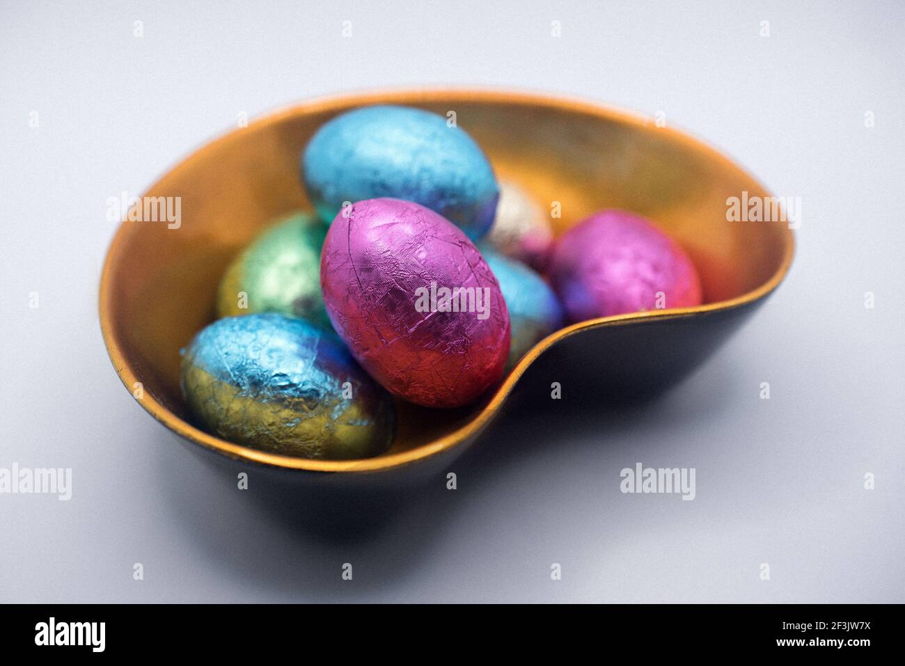 Chocolate Easter eggs in the lacquer bowl Stock Photo