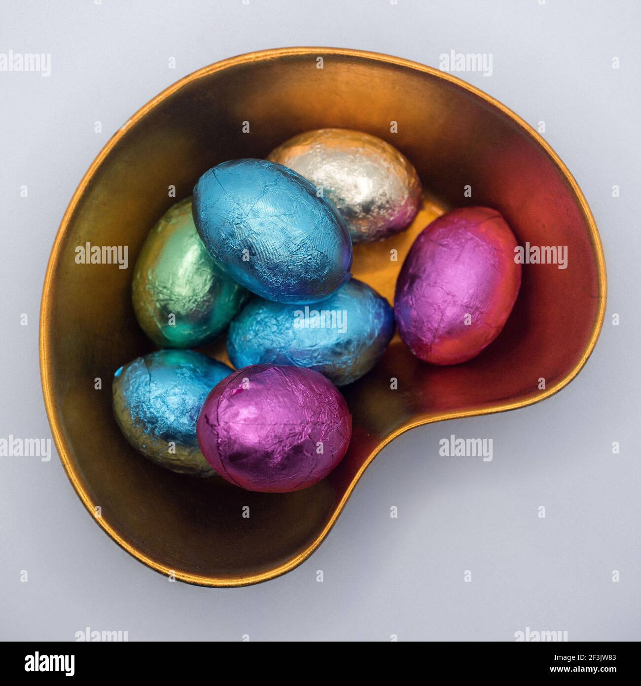 Chocolate Easter eggs in ceramic bowl Stock Photo