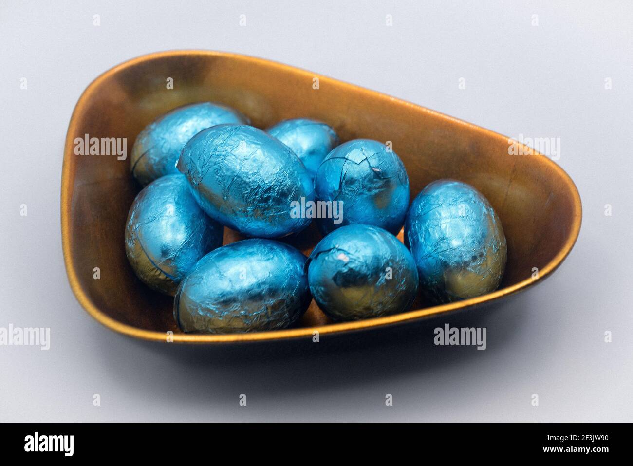 Chocolate Easter eggs in the lacquer bowl Stock Photo