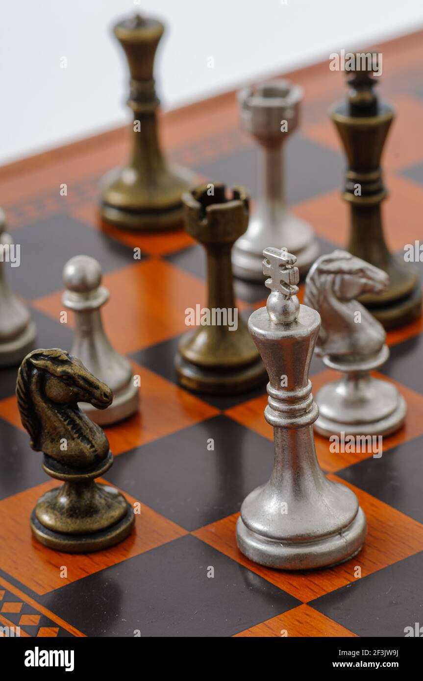 Ancient wooden chess pieces on an old chessboard Stock Photo - Alamy