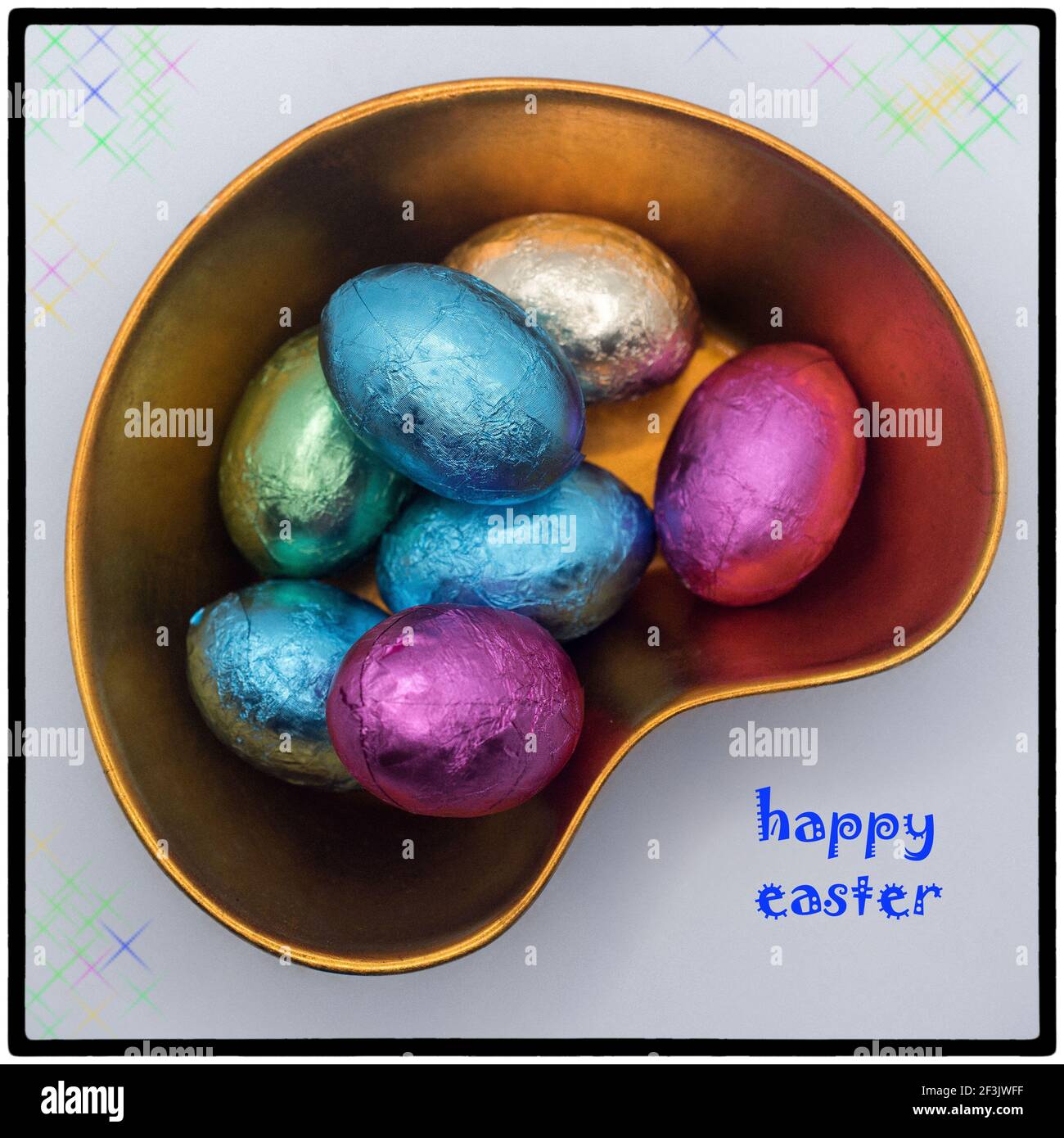 Easter chocolate eggs in the lacquer bowl with Happy Easter message Stock Photo