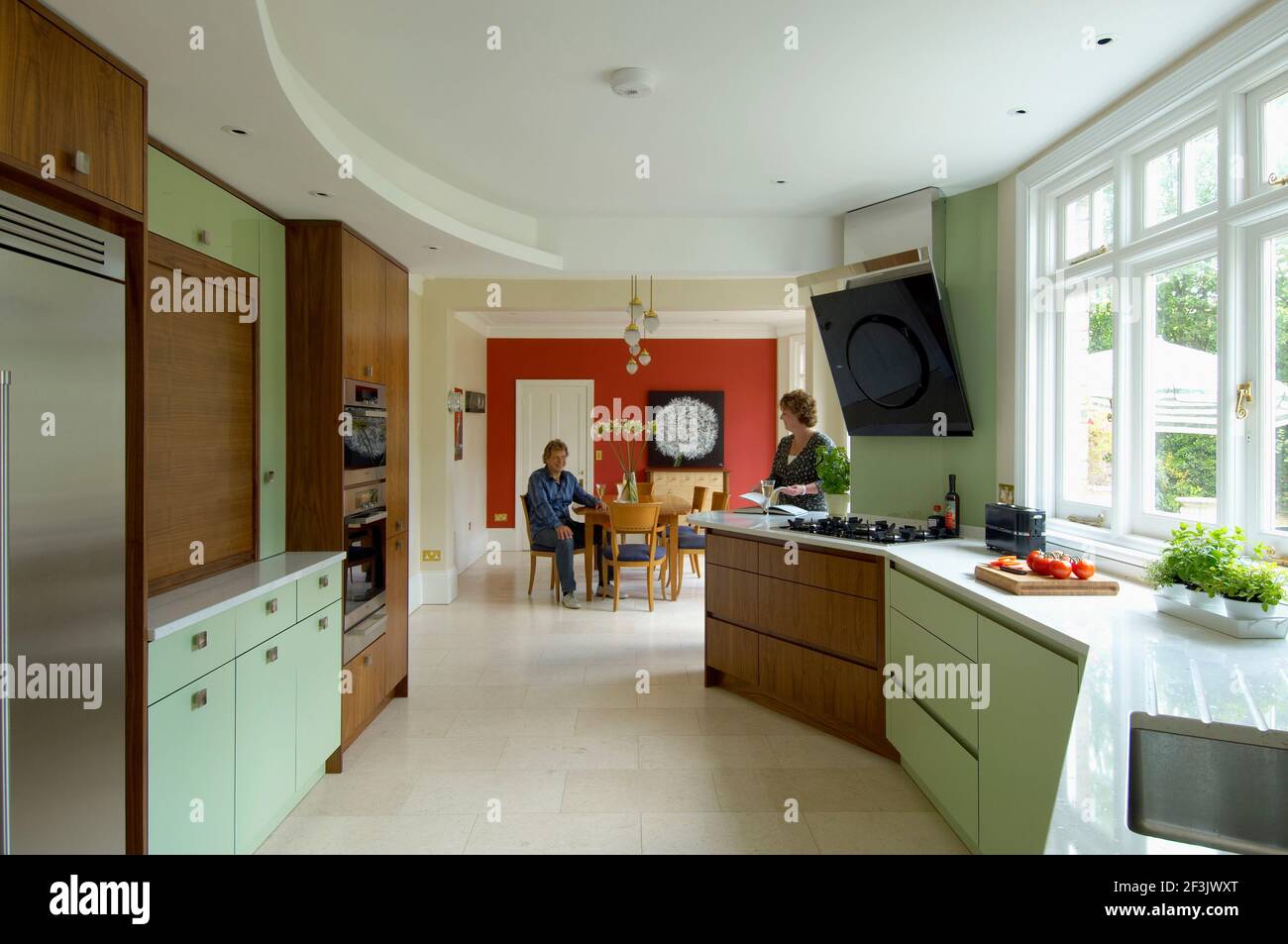 Contemporary Art Deco style walnut and mint Kitchen refurbishment Stock Photo