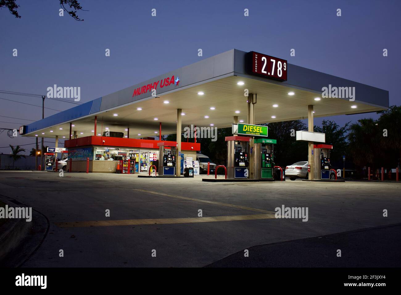 4/14/2021 Miami Florida - Murphy USA gas station and convenience store located on an out parcel of a Walmart Supercenter. Evening Stock Photo