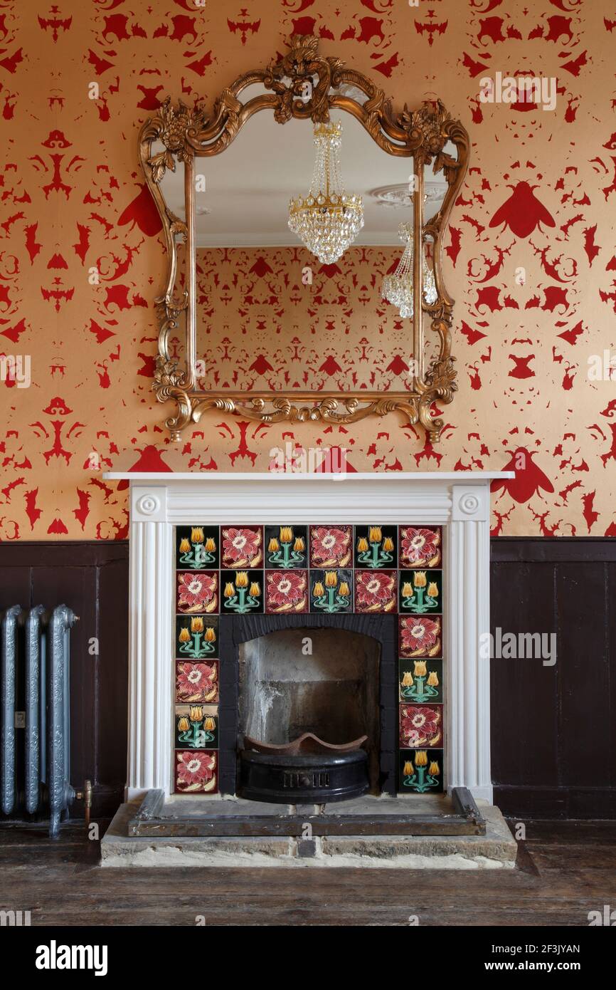 Ornate gold mirror over Victorian fireplace in upstairs function room |  | Designer: Richard Brett / We Like Today Stock Photo