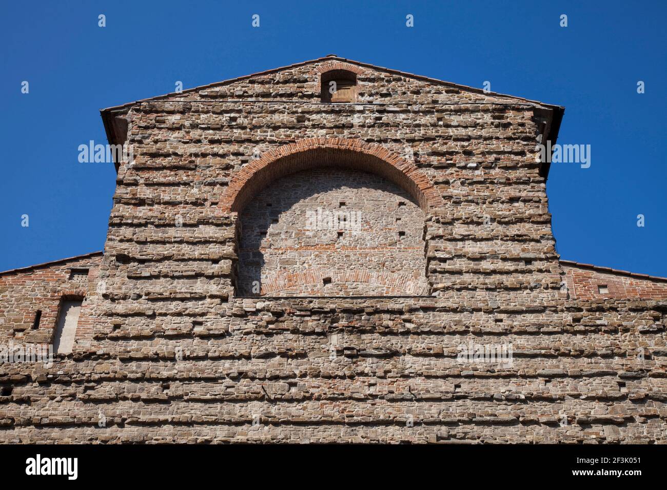 Worms eye view of the Basilica di San Lorenzo brick facade, Florence Stock Photo