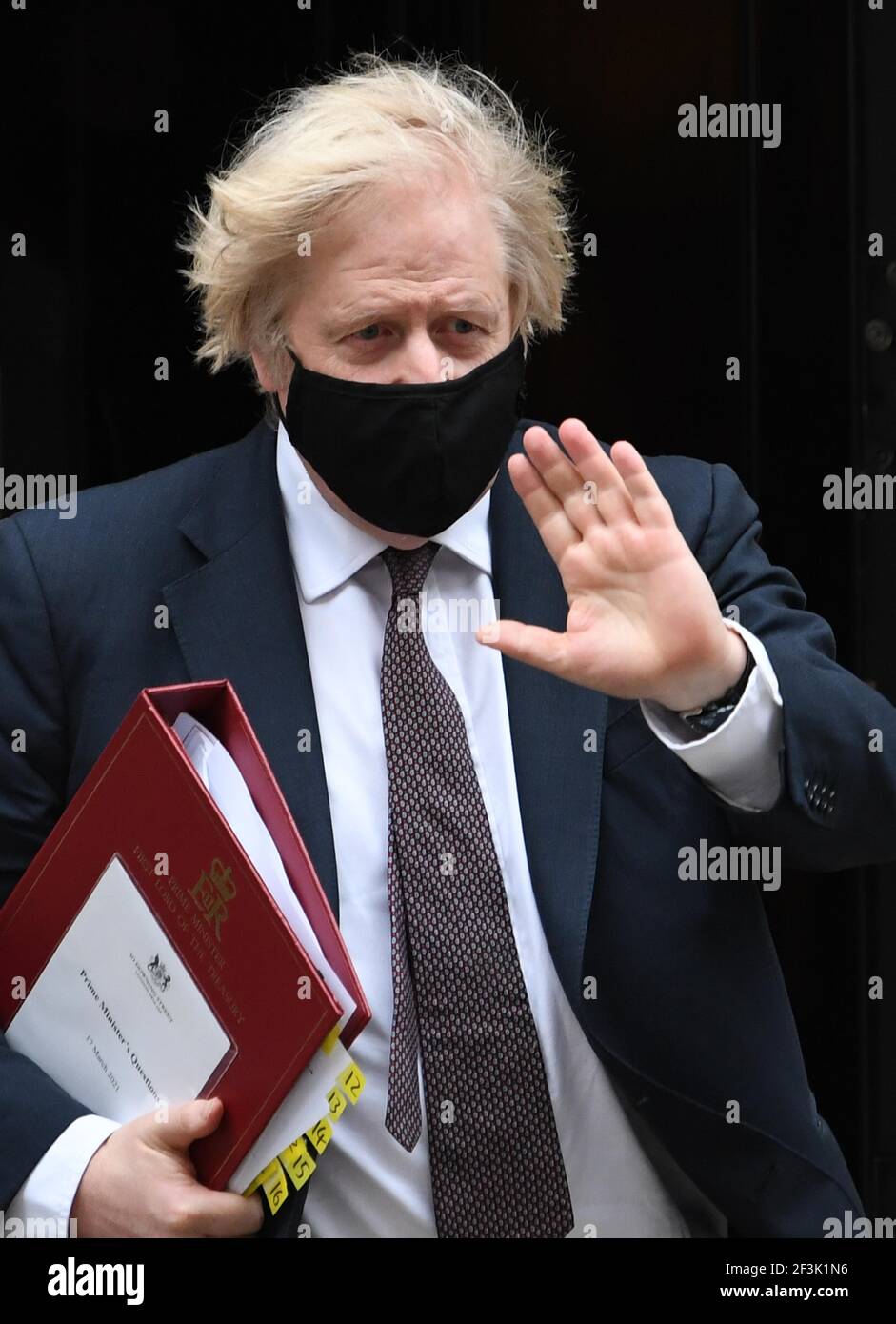 Prime Minister Boris Johnson leaves 10 Downing Street to attend Prime Minister's Questions at the Houses of Parliament, London. Picture date: Wednesday March 17, 2021. Stock Photo