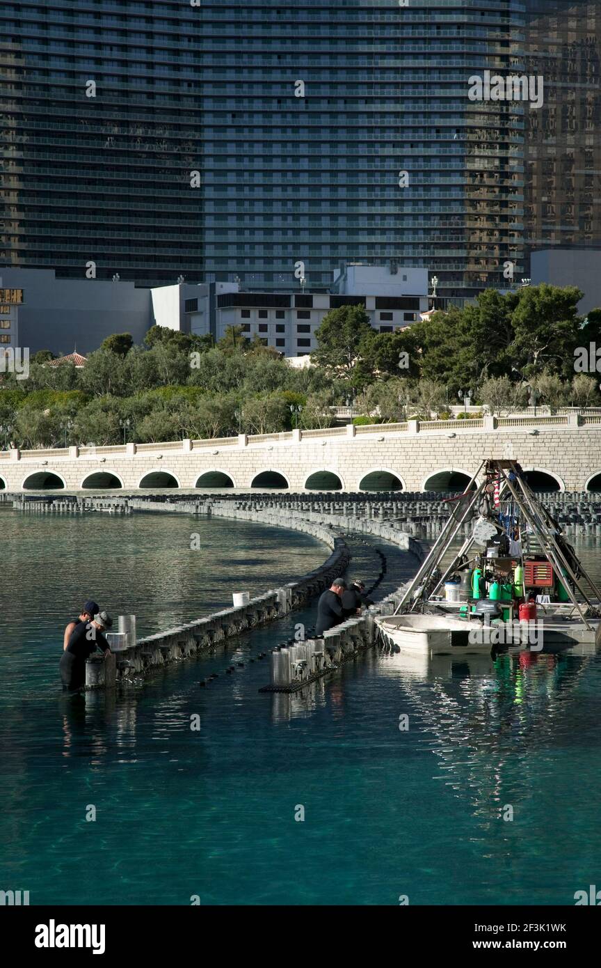 Workers perform maintenance on the lights of the famous Bellagio